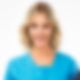 Blurred photo of a woman in blue.