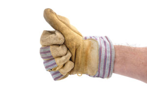 Hand in work glove giving thumbs up.